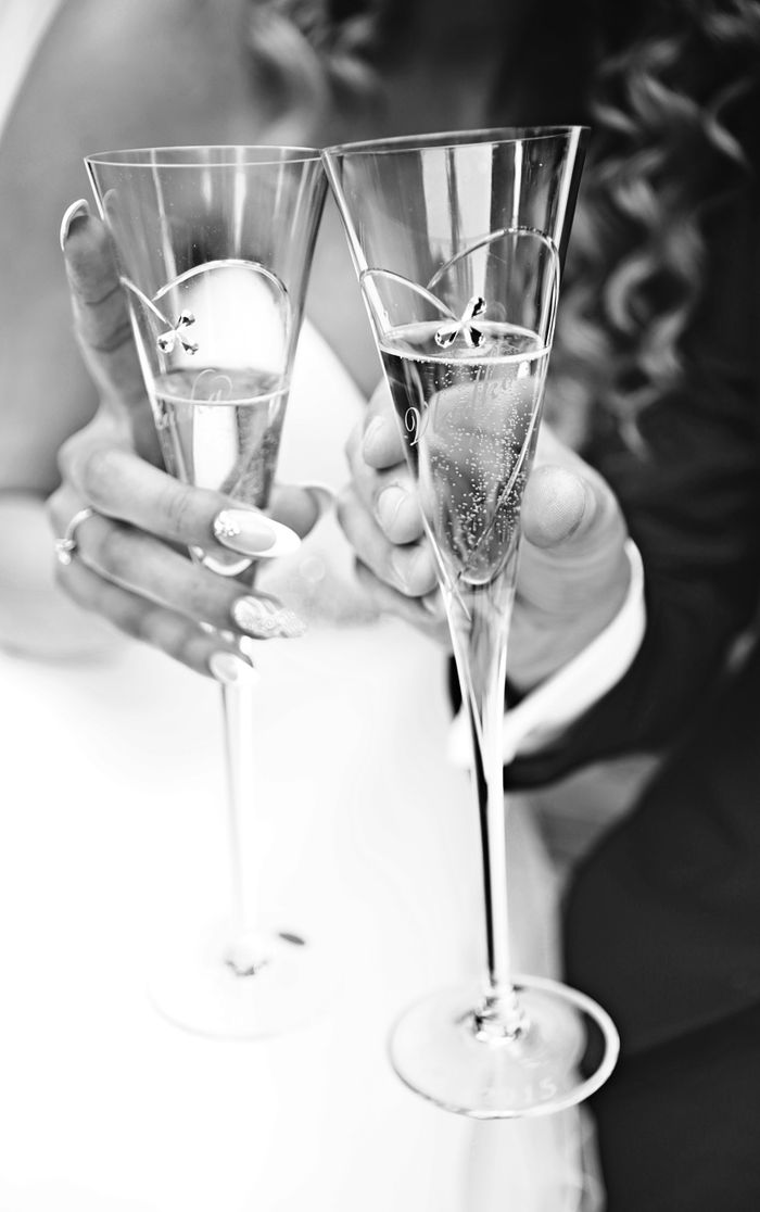 Crafting Captivating Headlines: Your awesome post title goes here Elegant black and white image of hands toasting with champagne glasses, perfect for wedding themes.